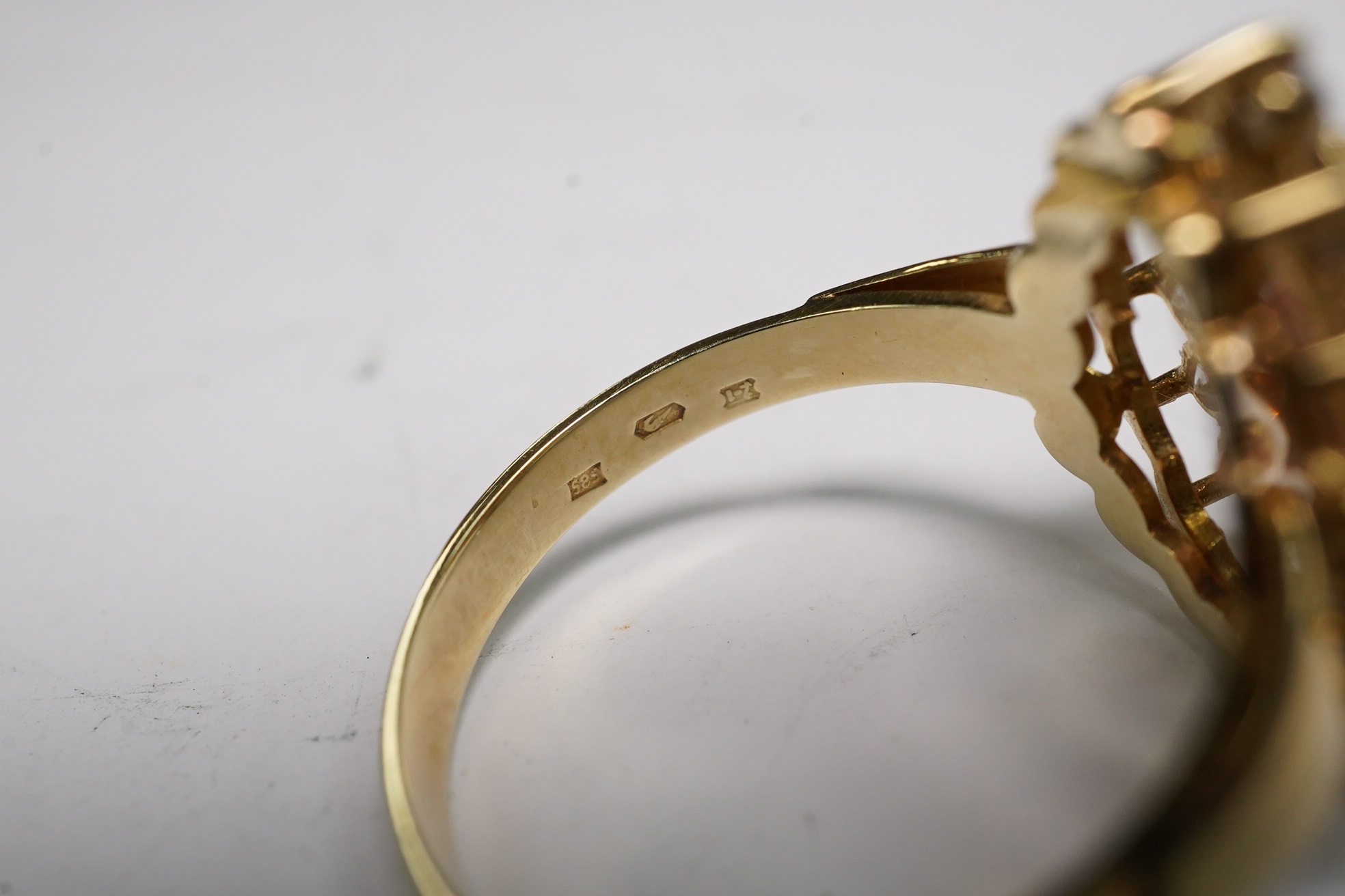 A 14k and simulated diamond set pear shaped cluster ring, size N, gross weight 3.8 grams. Condition - fair to good
